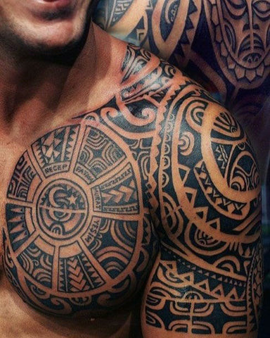 A Polynesian tribal tattoo design covering a man's entire shoulder