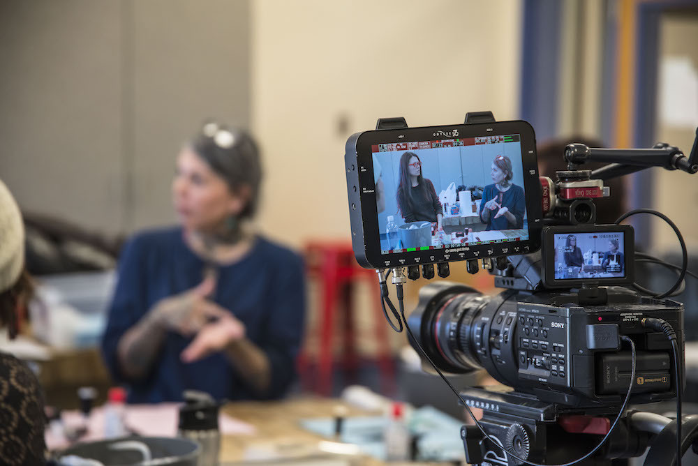 A film crew captures the Tupik Mi documentary, highlighting the cultural revival of Inuit tattooing and its impact on individuals and communities.