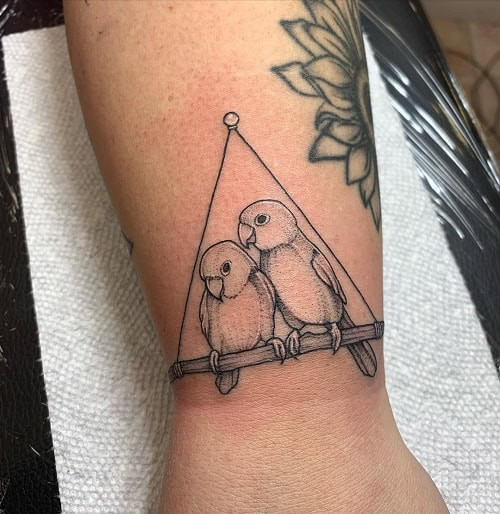 Meaningful two bird tattoo for men, symbolizing prosperity, love, and family bonds