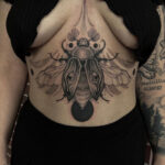 Floral lace under breast tattoo with rose and leaves