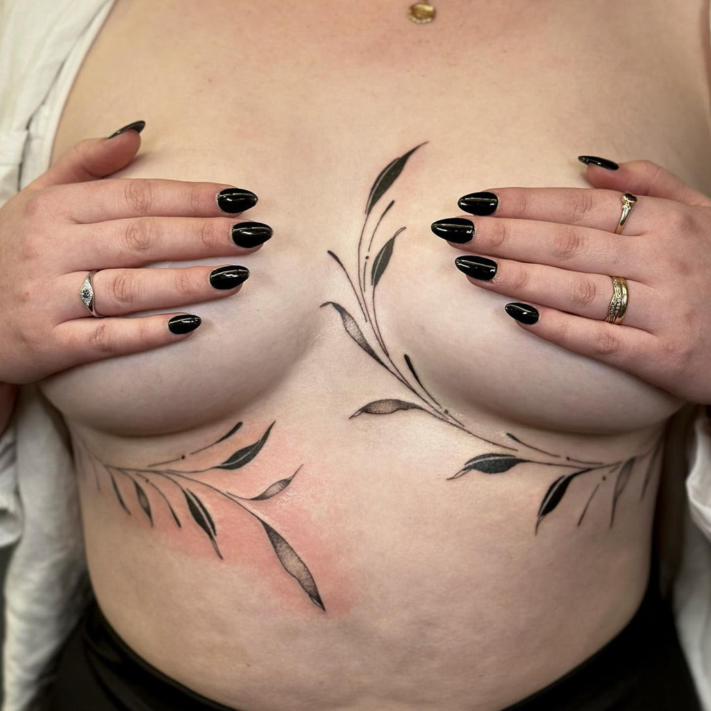 Fine line lace under breast tattoo with subtle shading