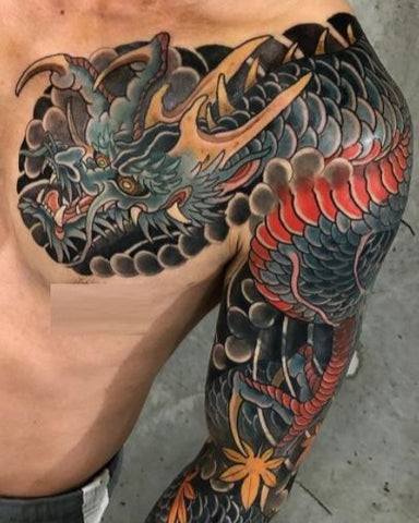 An abstract watercolor style tattoo on a man's shoulder