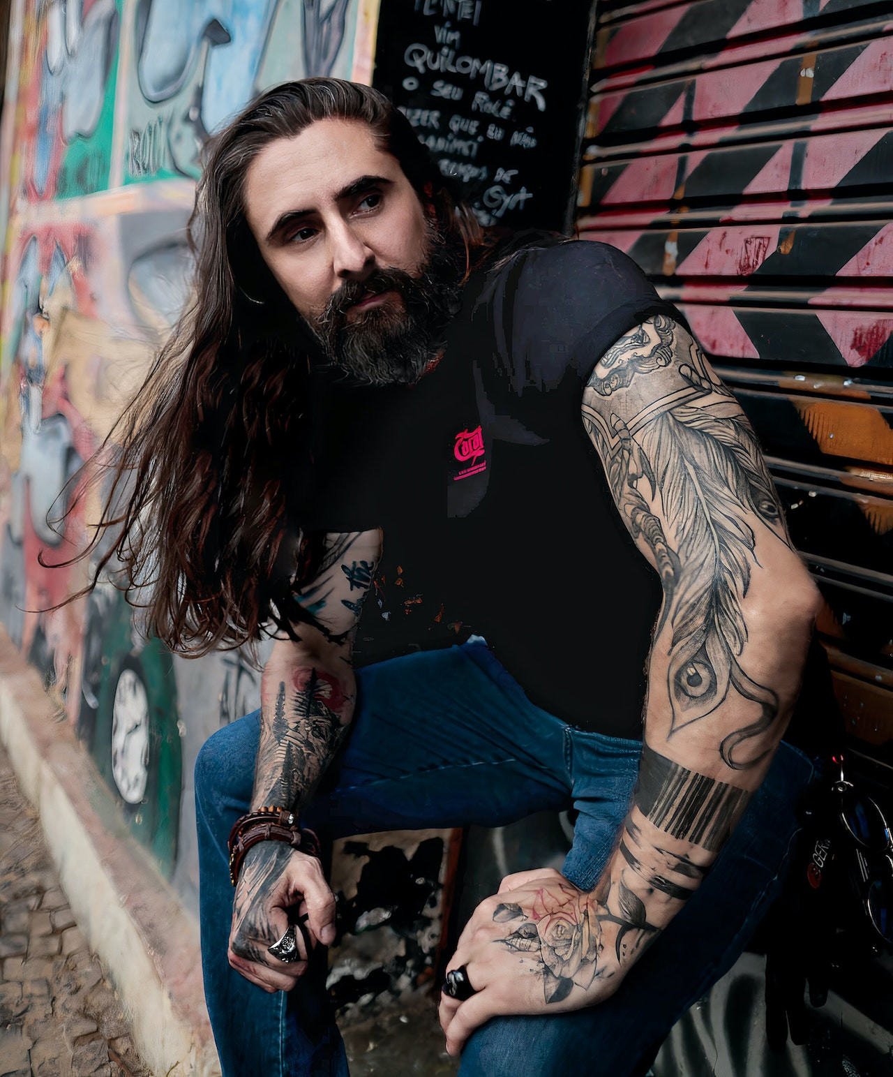 badass bearded tattooed man with full sleeve