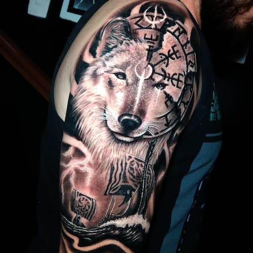 Viking raven and runes tattoo on a man's arm