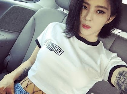 Han So Hee pre-debut photo showcasing arm tattoos