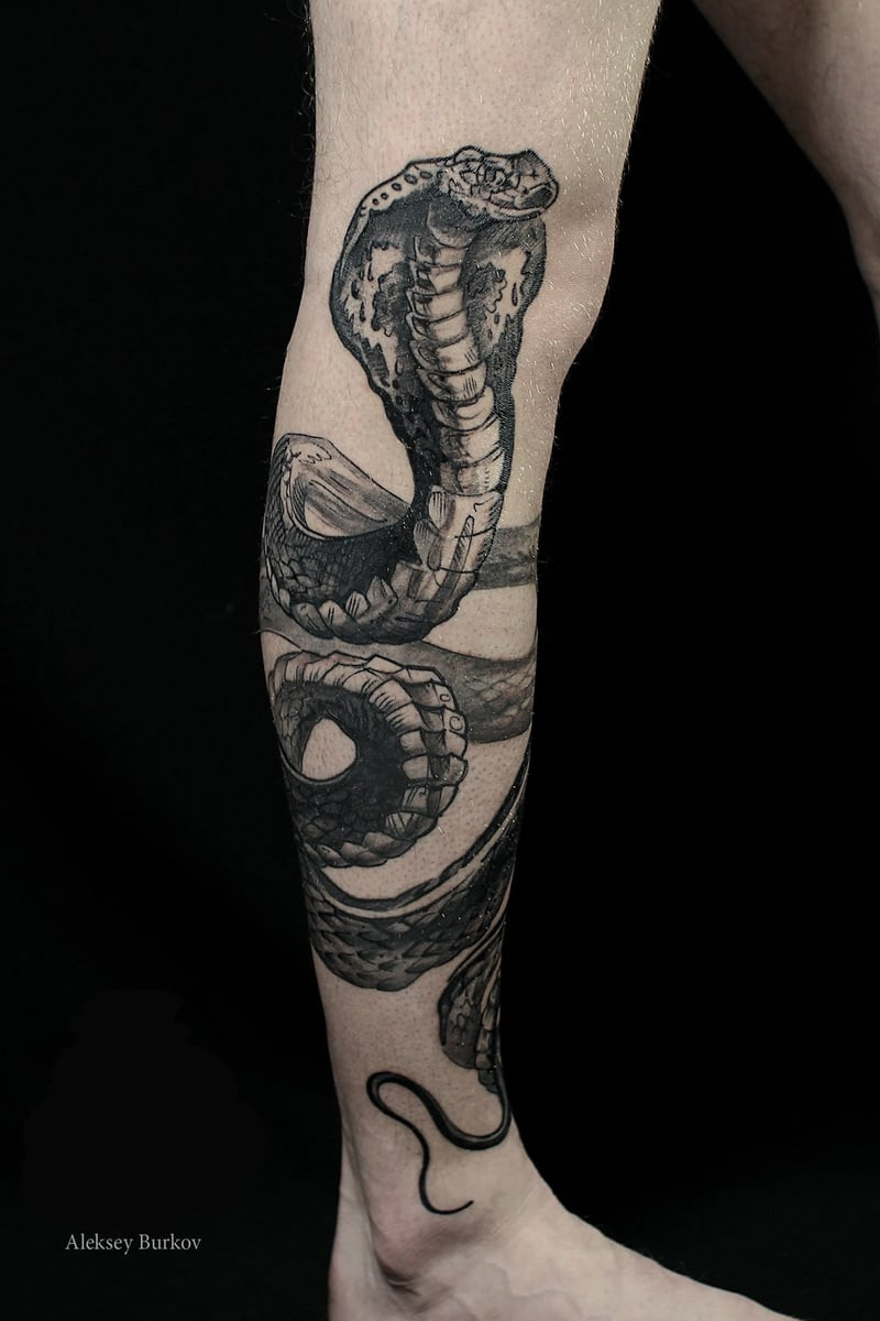 Realistic Snake Leg Tattoo Coiling Around the Thigh