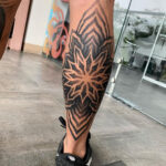 Calf Tattoo for Men with Intricate Design