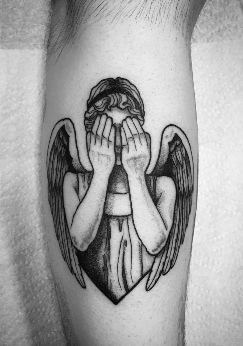 Intriguing weeping angel tattoo, with varied symbolism ranging from temptation to pop culture reference.