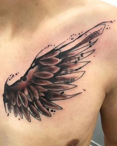 Man with a winged chest tattoo featuring large, feathered wings across his chest