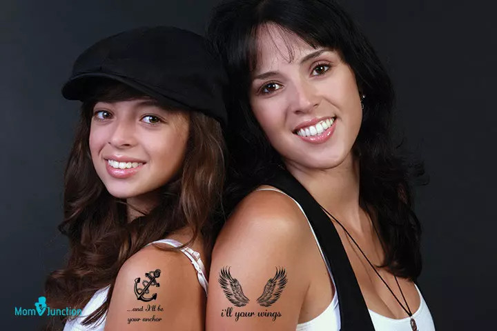 Wings and anchor mother-daughter tattoo, symbolizing mutual support