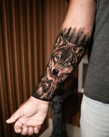 Wolf sleeve tattoo featuring a howling wolf in a forest setting with moon and trees