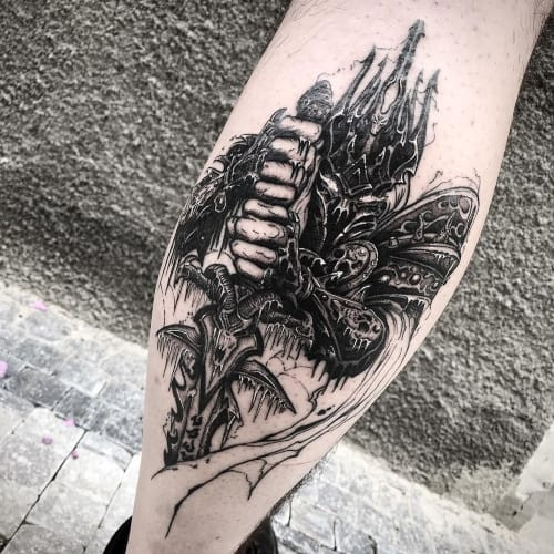 A World of Warcraft character tattoo on a man's arm, celebrating gaming passion