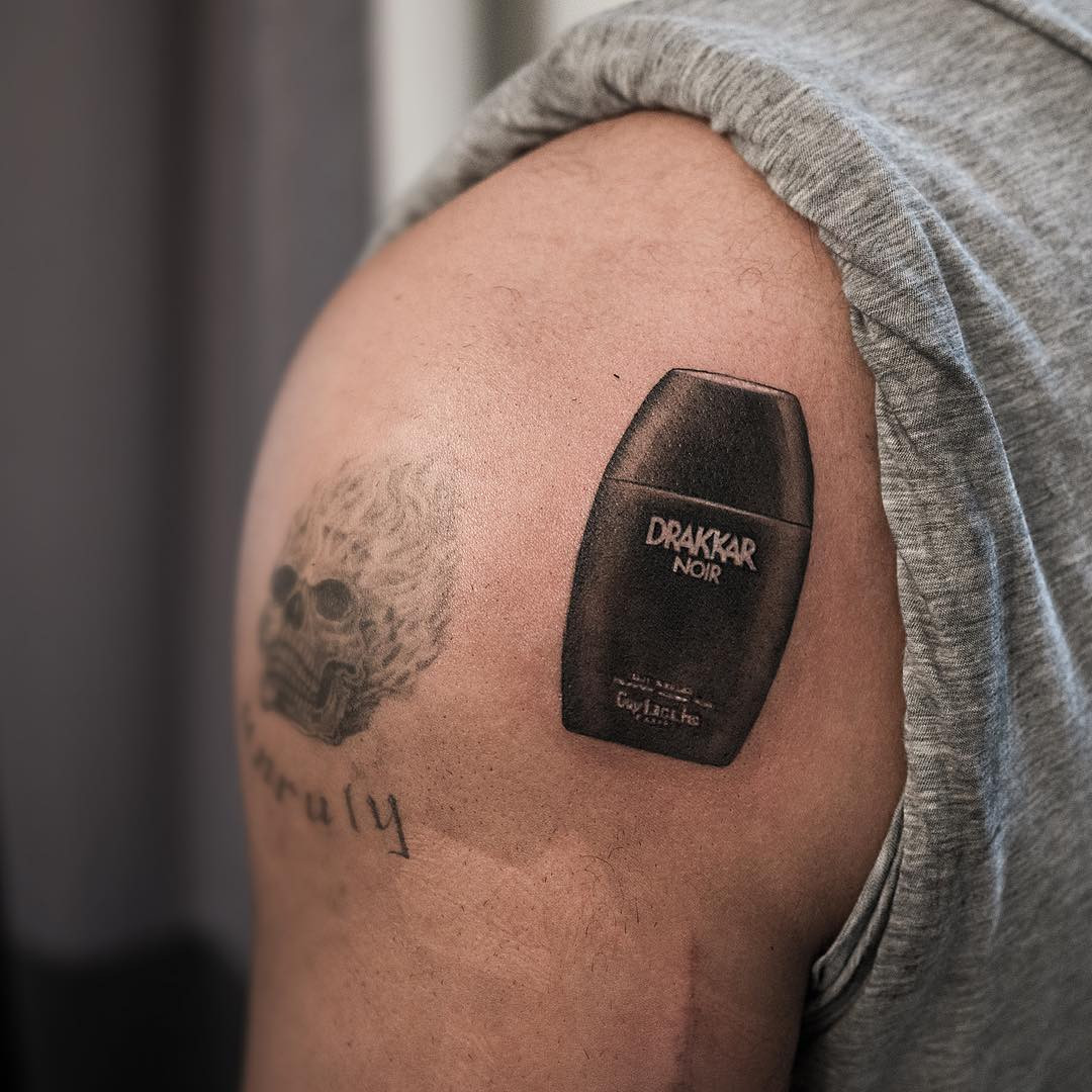 Drake's Drakkar Noir cologne bottle tattoo