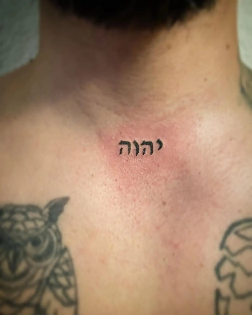 Yahweh Tattoo on the shoulder blade with a detailed Hebrew script design