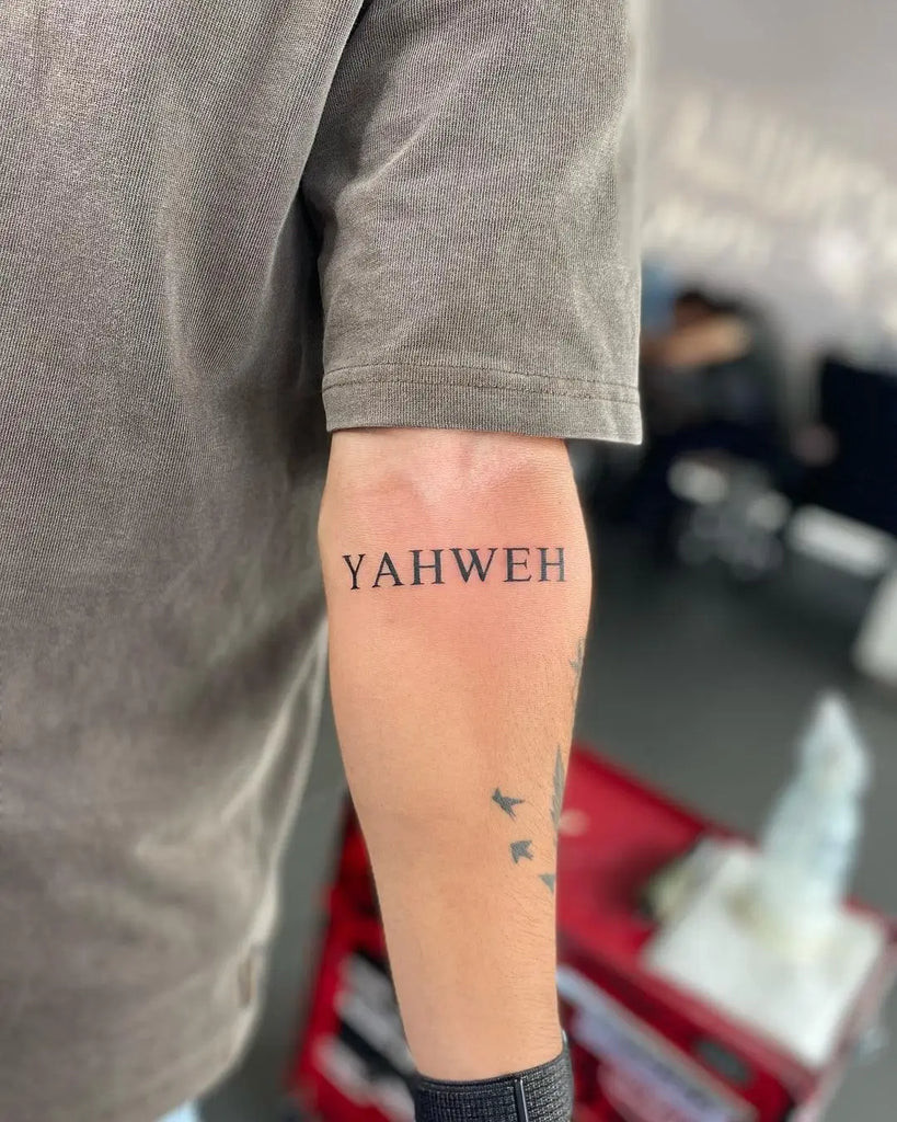 Yahweh Tattoo on the finger with a tiny and subtle Hebrew script letter