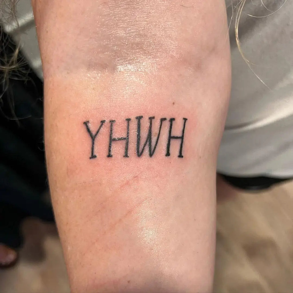 Delicate Yahweh Tattoo on the ankle using fine-line Hebrew calligraphy