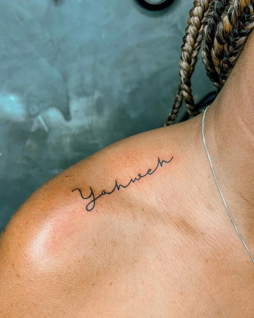 Yahweh Tattoo on the ribs with a vertical Hebrew script design