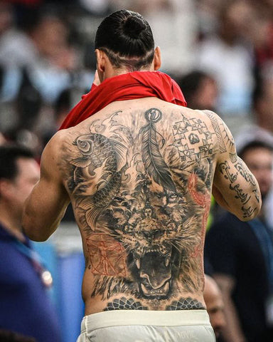 Zlatan Ibrahimović back tattoo, featuring a large roaring lion symbolizing strength