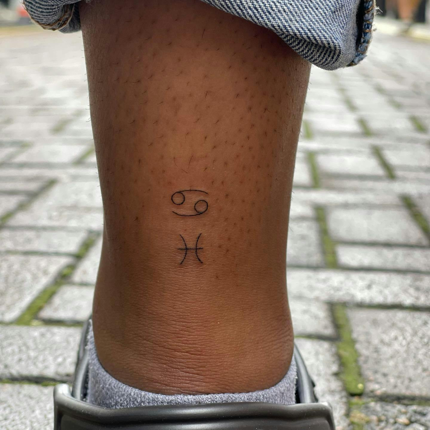 Zodiac sign ankle tattoo, minimalist zodiac symbol on ankle.