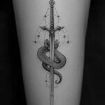 woman sword tattoo