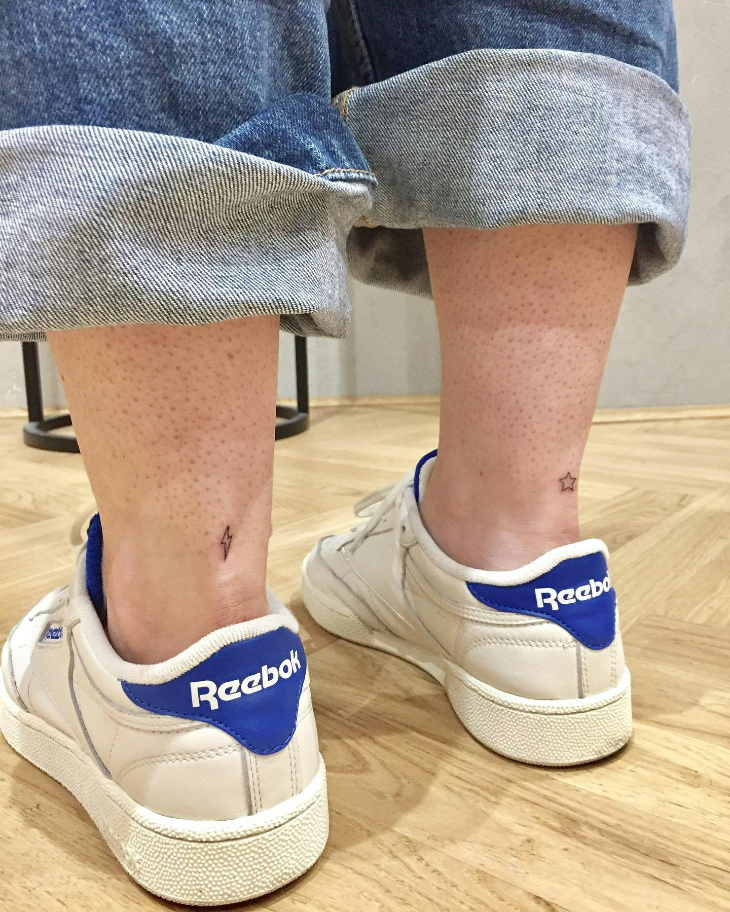 Ankle tattoos on both ankles