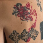 Blackwork blast over tattoo with bold black lines