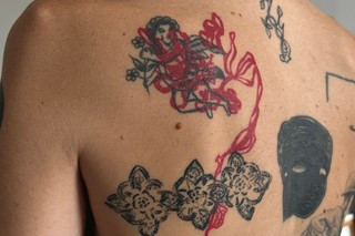 Blackwork blast over tattoo with bold black lines
