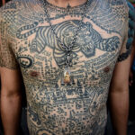 Close-up of intricate traditional Thai tattoos