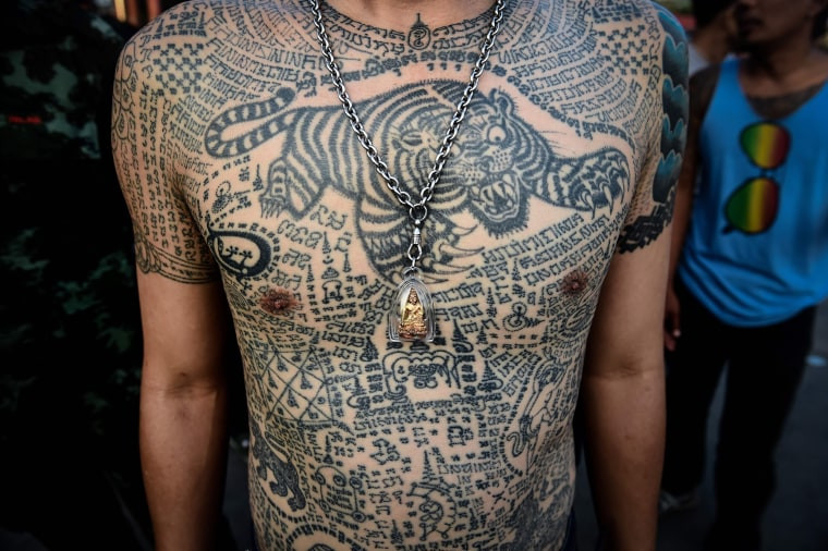 Close-up of intricate traditional Thai tattoos