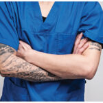 Doctor with tattoo on arm