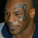 Mike Tyson's iconic tribal face tattoo at a 2003 press conference