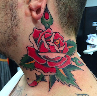 A detailed neck tattoo featuring intricate floral patterns
