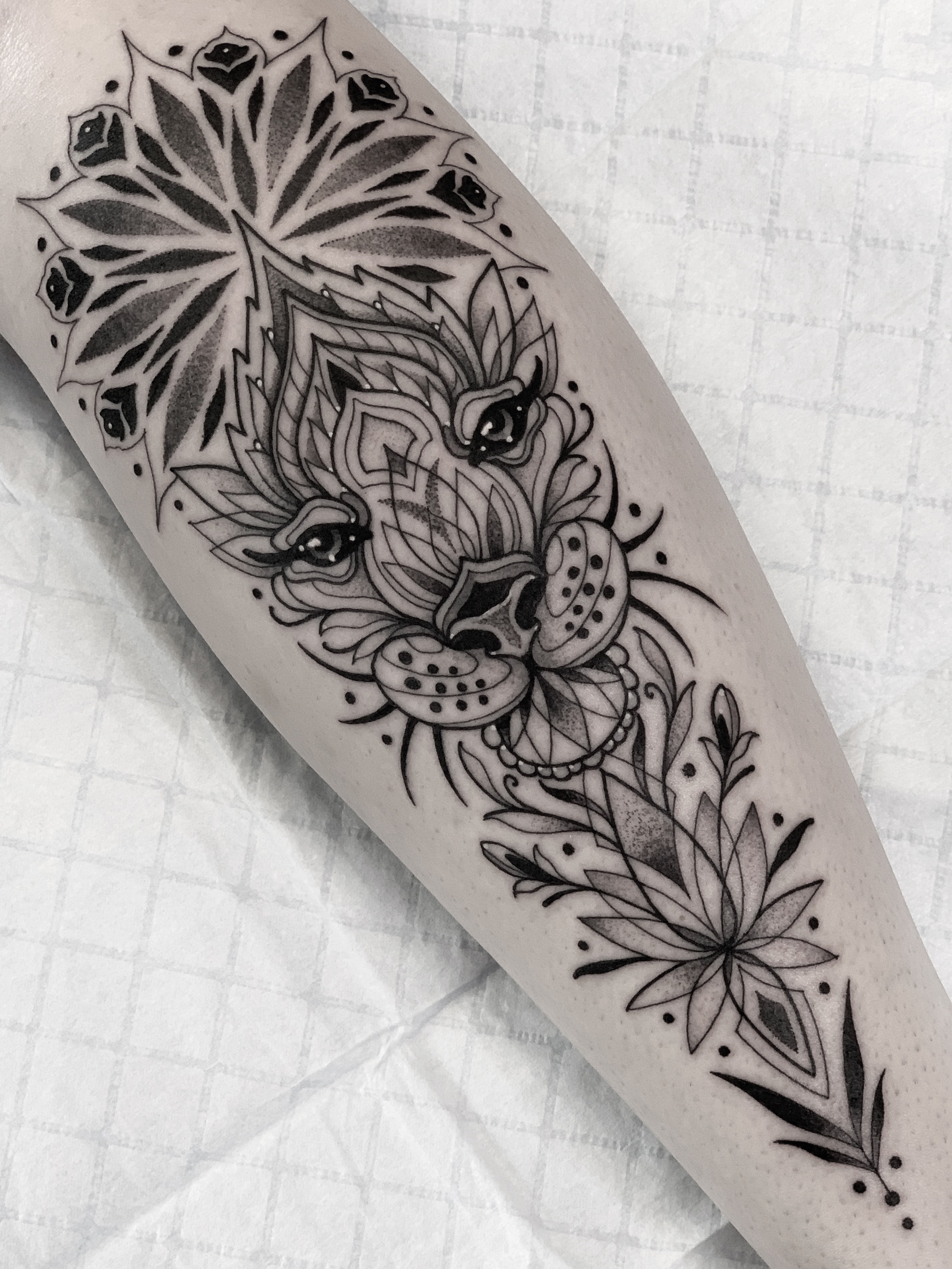 Ornamental big cat geometric tattoo by Tommy Sisneros