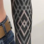 White Ink over Blackwork Tattoo