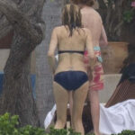 Julia Roberts' lower back tattoo displaying her children's names and husband's initials.