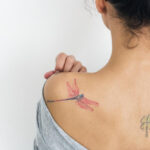 Laser tattoo removal machine in action, removing ink with precision