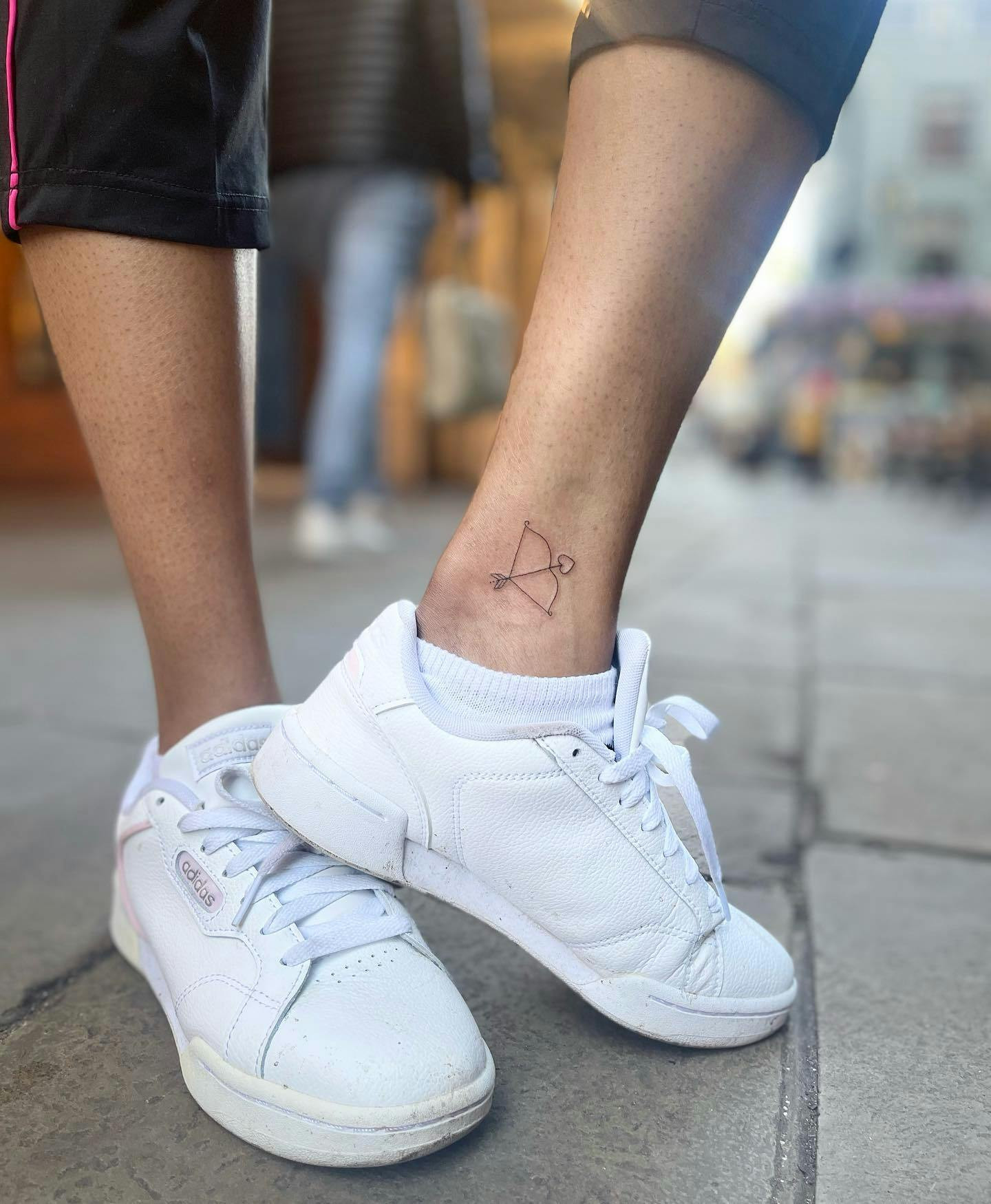 Cupid's arrow ankle tattoo