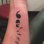 Semicolon tattoo turning into birds symbolizing a 'f*ck you' to suicide and the important people who kept the person on earth