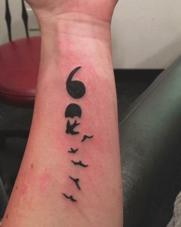 Semicolon tattoo turning into birds symbolizing a 'f*ck you' to suicide and the important people who kept the person on earth