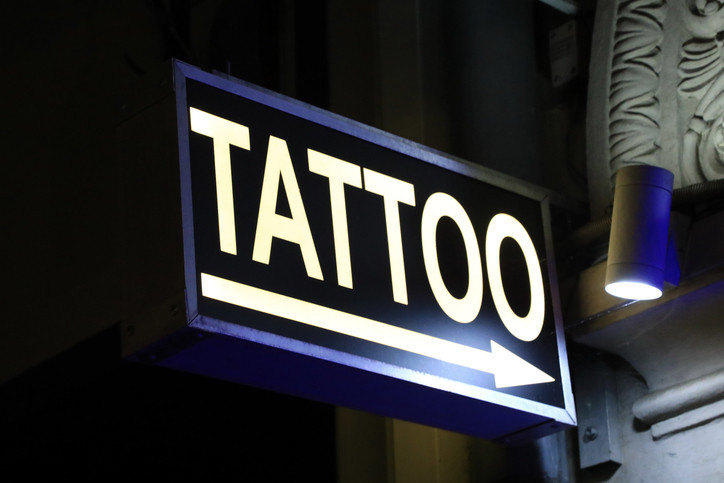A vibrant tattoo design on a person's arm, showcasing intricate details and bold colors, emphasizing artistic expression and personal style.