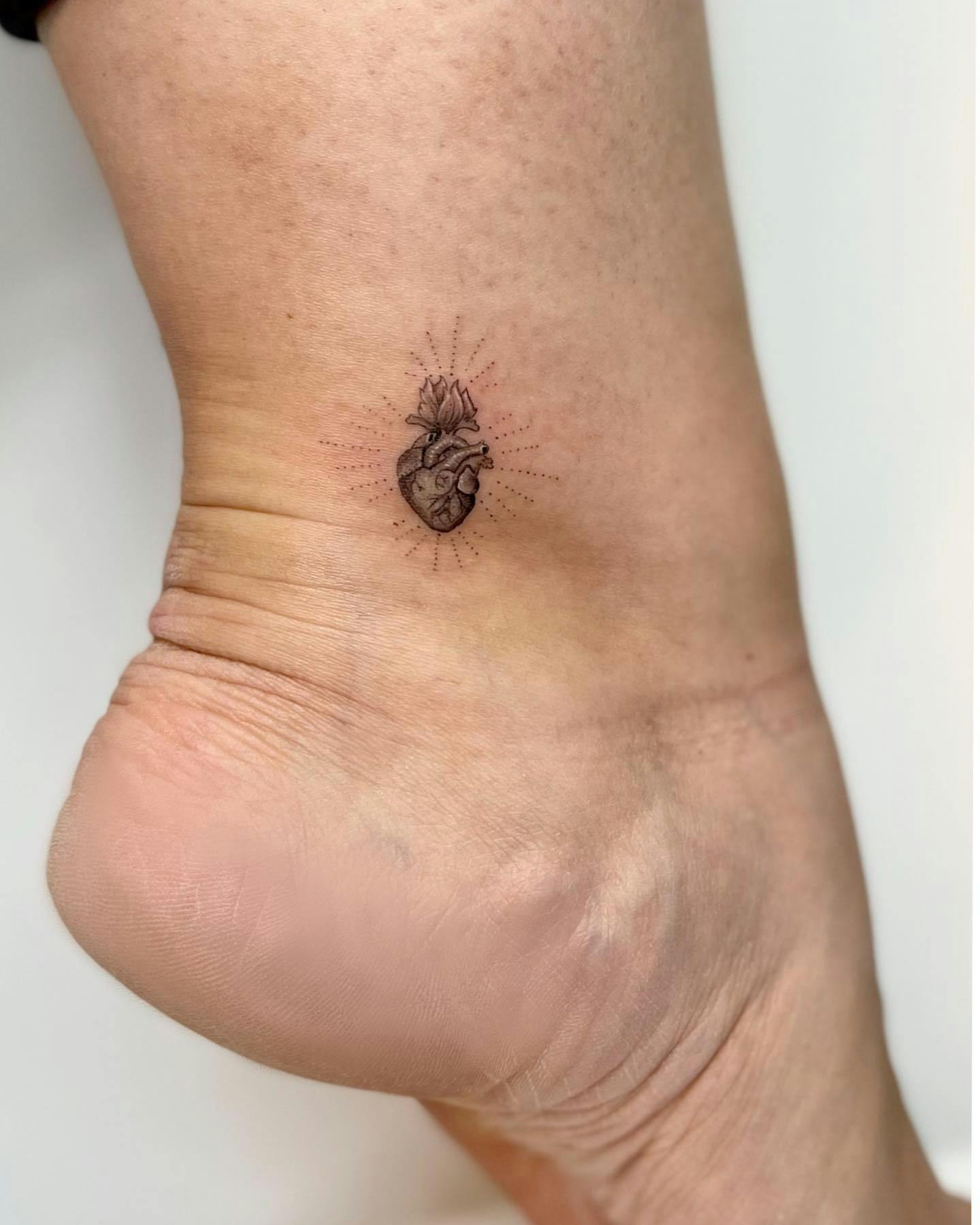 Literal heart ankle tattoo