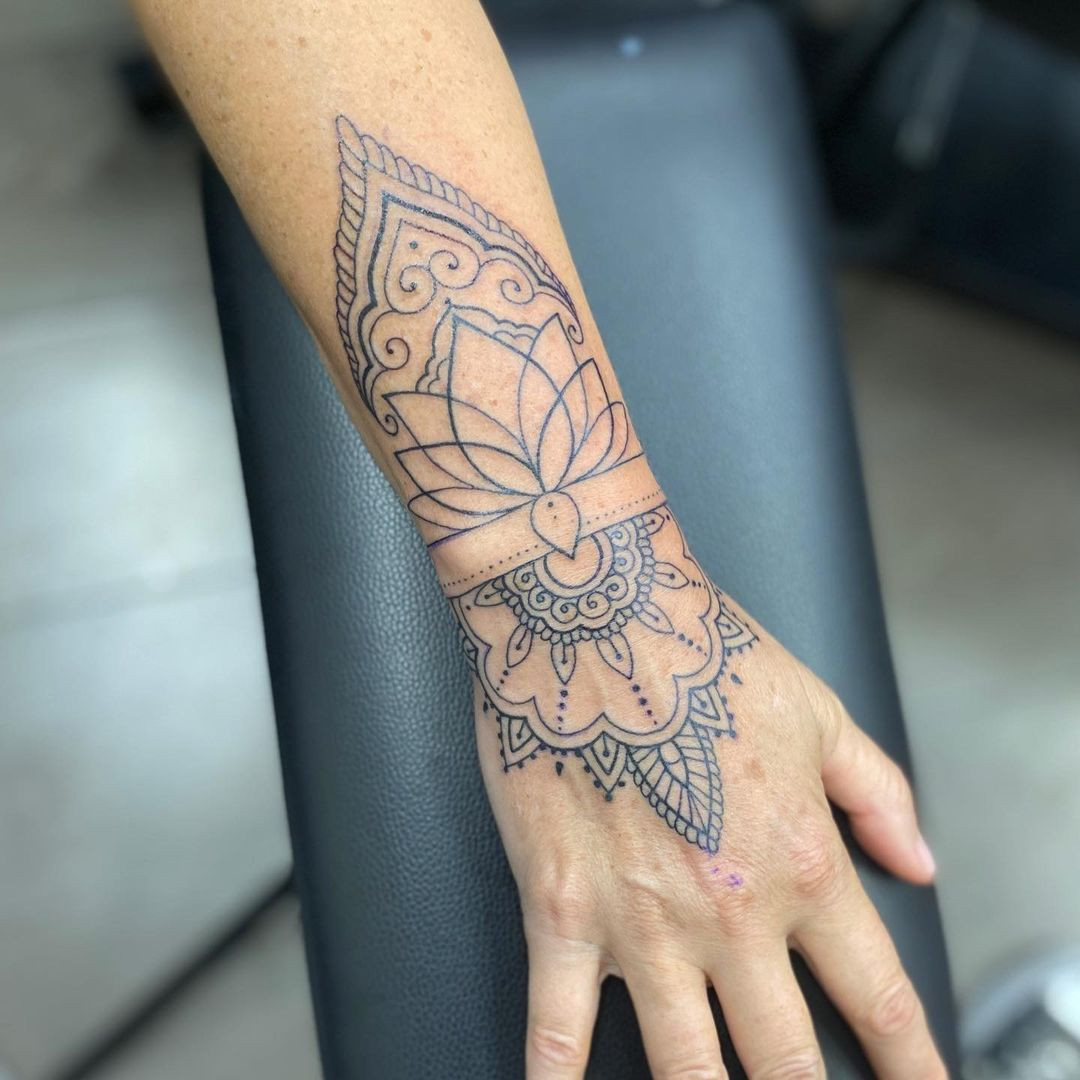 A hand ornamental tattoo design inspired by Rihanna's tattoo, making a bold and fashionable statement.