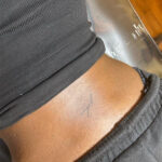 Renee Washington rocking a lower back tattoo