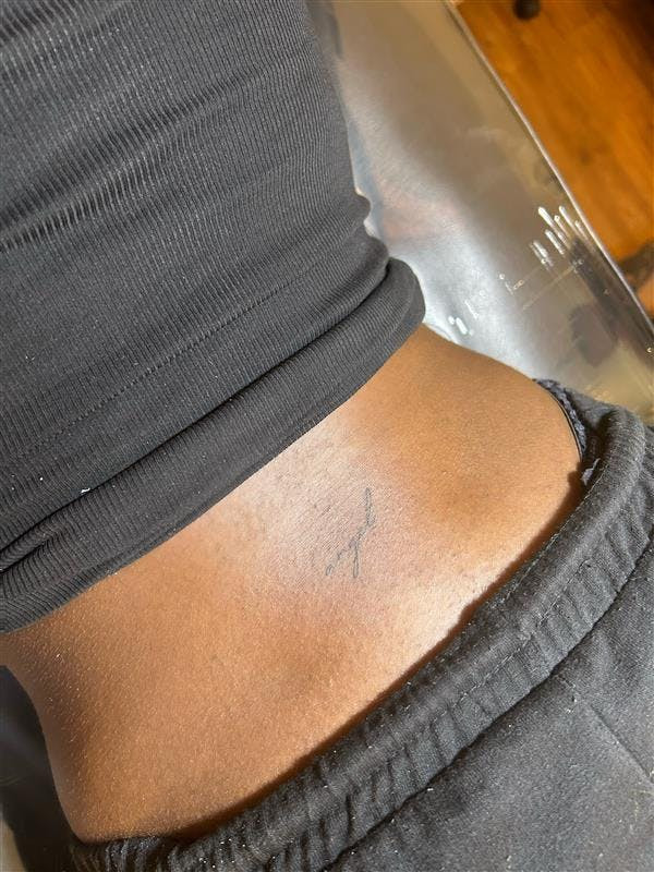 Renee Washington rocking a lower back tattoo
