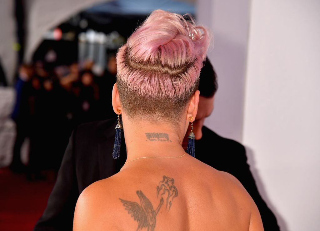 Pink's guardian angel tattoo on her back, demonstrating a large-scale tattoo