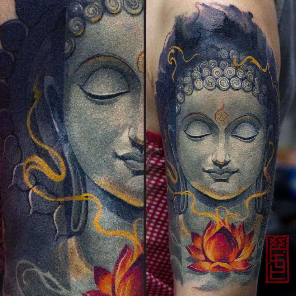 A striking Buddha portrait tattoo on a person's arm