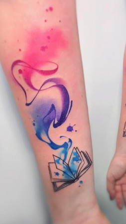 Watercolor book tattoo with galaxy