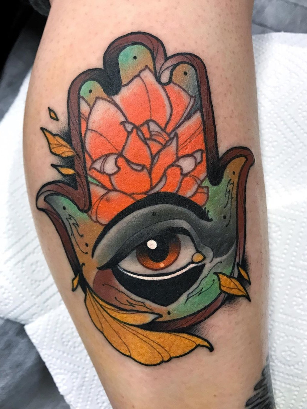 A minimalistic Hamsa tattoo, demonstrating its accessibility and appeal to people of all backgrounds