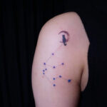 Woman with star tattoos on her shoulder blades