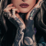 Emily Dickinson, a poet known for her exploration of identity and inner self, sparks curiosity about her potential connection to tattoos as a form of self-expression.